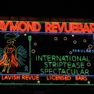 Neon sign made in the 1950s for Raymond Revuebar in Soho, London, photographed in 2015 after restoration and reinstallation.