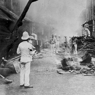 Shropshire Regiment ‘Whitewash Brigade’ emptying items from Chinese homes in Taipingshan, Hong Kong, and burning them on the street as an epidemic control measure during the 1894 plague outbreak.