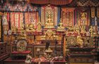 Gilded statues and ritual objects arranged by Alice S. Kandell