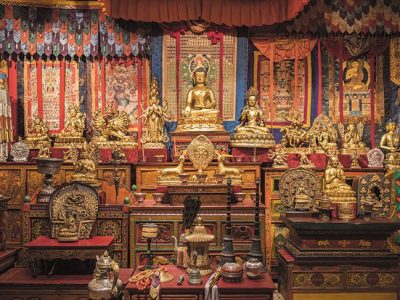 Gilded statues and ritual objects arranged by Alice S. Kandell