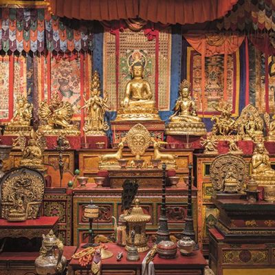Gilded statues and ritual objects arranged by Alice S. Kandell