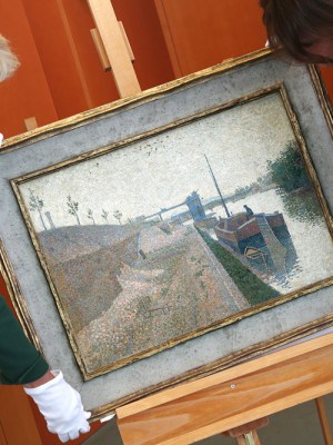 Monika Gruetters (left) hands over the painting ‘Quai de Clichy’ by Paul Signac to Agnes Sevestre-Barbe, representative of the heiress, as part of the return of art stolen under the Nazis and hoarded by Cornelius Gurlitt, the son of Nazi-era dealer Hildebrand Gurlitt in Berlin on July 3, 2019.