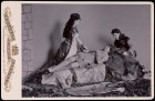 Photograph taken at Balmoral in 1893/94 by Charles Albert Wilson. Ethel Cadogan, Lord William Cecil and Dr Alexander Profeit re-enact a scene from Ivanhoe by Sir Walter Scott in which Rebecca and a page kneel over Ivanhoe. Royal Collection Trust/© HM Queen Elizabeth II 2020