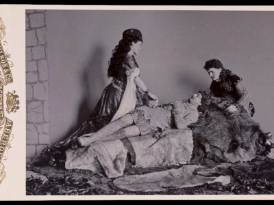 Photograph taken at Balmoral in 1893/94 by Charles Albert Wilson. Ethel Cadogan, Lord William Cecil and Dr Alexander Profeit re-enact a scene from Ivanhoe by Sir Walter Scott in which Rebecca and a page kneel over Ivanhoe. Royal Collection Trust/© HM Queen Elizabeth II 2020