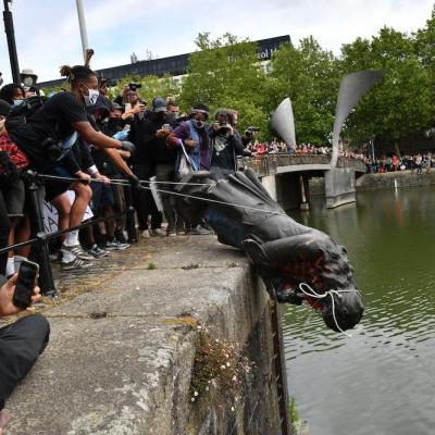 Protesters throwing the statue of Edward Colston into Bristol harbour on 7 June 2020.