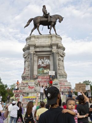 People gather around the Robert E. Lee statue on Monument Avenue in Richmond, Virginia, on June 4, 2020. Earlier, Virginia governor Ralph Northam announced plans to remove the statue of the Confederate general. Photo: Ryan M. Kelly/AFP via Getty Images
