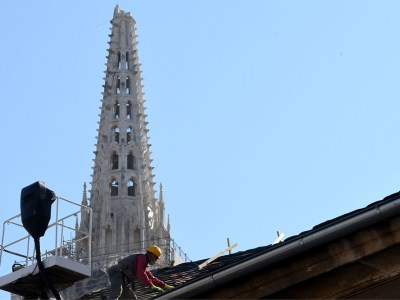 A builder works on the roof of the south tower of Zagreb's cathedral in April 2020 following the 5.3-magnitude earthquake in downtown Zagreb on 22 March. Photo: DENIS LOVROVIC/AFP via Getty Images