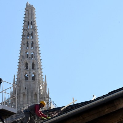 A builder works on the roof of the south tower of Zagreb's cathedral in April 2020 following the 5.3-magnitude earthquake in downtown Zagreb on 22 March. Photo: DENIS LOVROVIC/AFP via Getty Images
