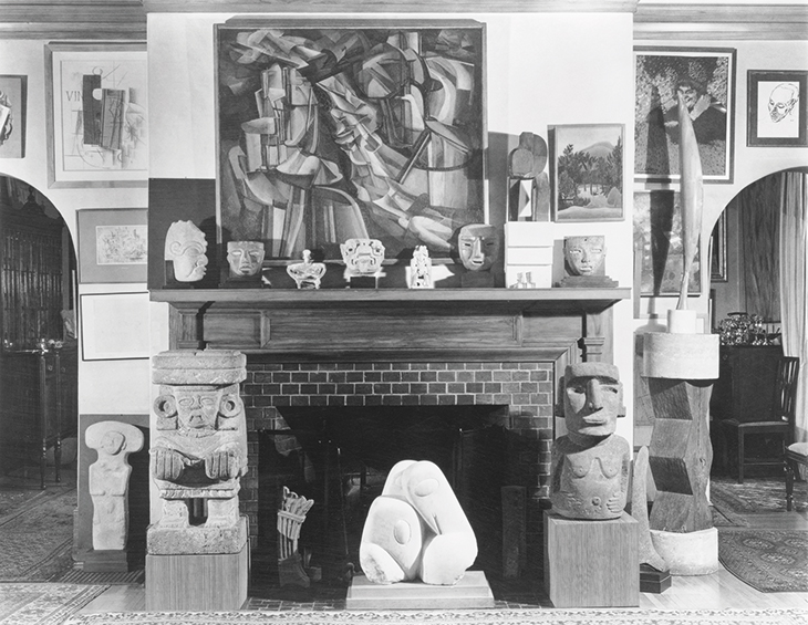 Photograph taken by Floyd Faxon in c. January 1951 of the living room, with views into the dining room through the north and south archways, of 7065 Hillside Avenue.