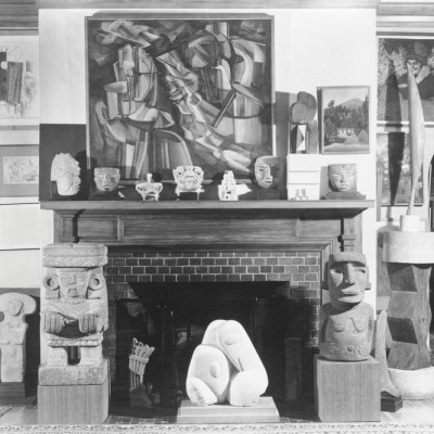Photograph taken by Floyd Faxon in c. January 1951 of the living room, with views into the dining room through the north and south archways, of 7065 Hillside Avenue.