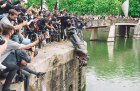 Bronze guilt: the statue of Edward Colston being pushed into Bristol Harbour in June 2020.