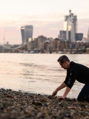 Bank vault: mudlarker Jason Sandy on the foreshore of the River Thames.