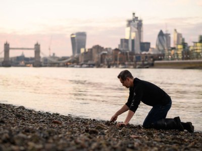 Bank vault: mudlarker Jason Sandy on the foreshore of the River Thames.