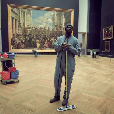 Omar Sy as Assane Diop in 'Lupin', with Veronese's 'Wedding Feast at Cana' in the background.