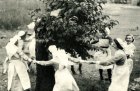 Nurses dance around the Bethnal Green mulberry in 1944, three years after it was bombed.