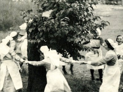 Nurses dance around the Bethnal Green mulberry in 1944, three years after it was bombed.