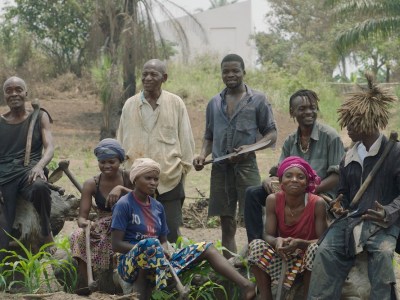 The Cercle d'Art des Travailleurs de Plantation Congolaise standing before the White Cube in Lusanga