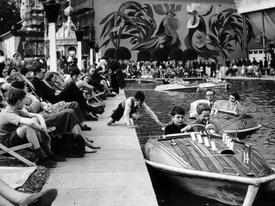 Children on the boating lake in Battersea Gardens at the Festival of Britain in 1951.