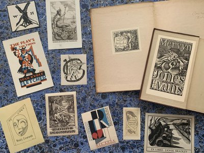 A selection of the bookplates in Simon Martin’s collection, showing the following plates (clockwise from top left): William Nicholson’s for William Heinemann; Stephen Gooden’s for John Raymond Danson; John Craxton’s for Stephen and Natasha Spender; Keith Vaughan’s for Mervyn Jones Evans, John Nash’s for Lionel Bradley, Eric Gill’s for Mary Gill, E. McKnight Kauffer’s for Jeanette Rutherston, Keith Vaughan’s for John Lehmann, Gladys Calthrop’s for Nöel Coward, and E. McKnight Kauffer’s for Ifan Kyrle Fletcher.