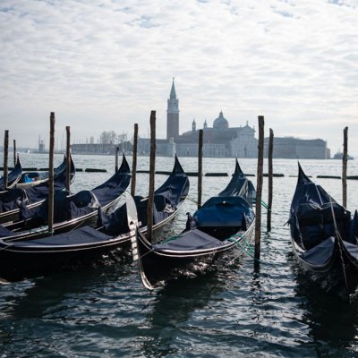 In hibernation: covered gondolas line the shore in Venice in December 2020.