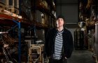 Bedwyr Williams with the Science Museum Group Collection at the National Collections Centre in Wiltshire. The artist is currently working with local audiences to create a film and accompanying book as a response to the collection, which will go in view at the collection centre when it opens to the public in 2024.