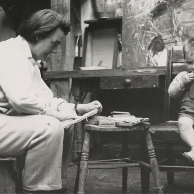 Joan Eardley sketching in her studio in Townhead, Glasgow (photo by Audrey Walker, c. 1949–51). Collection Scottish National Gallery of Modern Art