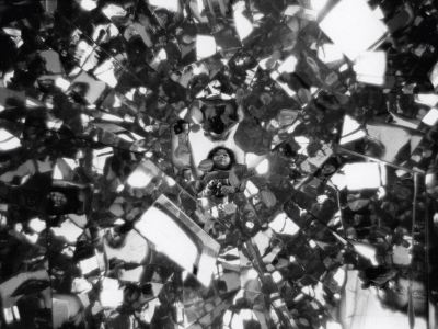 Photograph of Shigeko Kubota reflected in Three Mountains (1976–79) in her loft on Mercer Street, New York (1979), Peter Moore.