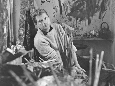 Francis Bacon photographed by Cecil Beaton in 1960 in his studio at Overstrand Mansions in Battersea, London.