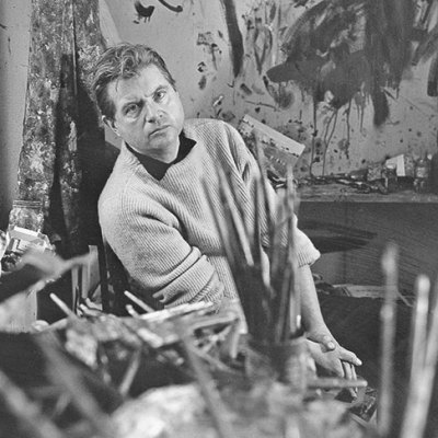 Francis Bacon photographed by Cecil Beaton in 1960 in his studio at Overstrand Mansions in Battersea, London.