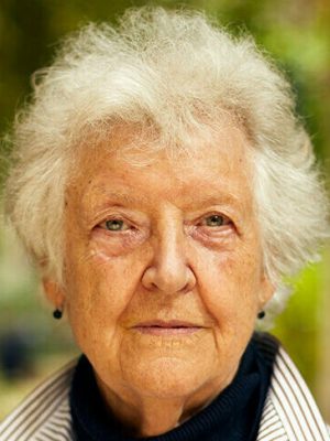 Sheila Hicks photographed in the courtyard outside her studio in Paris in August 2021.