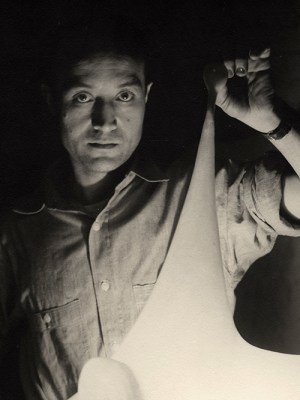 Isamu Noguchi with study for Luminous Plastic Sculpture, 1943