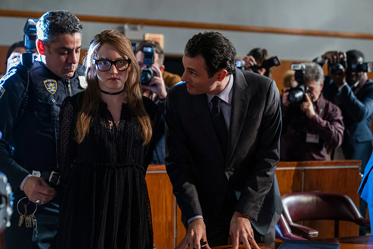 Julia Garner as Anna Sorokin with Arian Moayed (right) playing Sorokin’s trial lawyer.