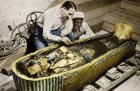 Howard Carter photographed with the golden sarcophagus of Tutankhamun in 1922 by Harry Burton (colourised version).