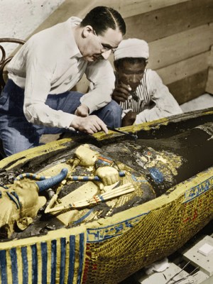 Howard Carter photographed with the golden sarcophagus of Tutankhamun in 1922 by Harry Burton (colourised version).