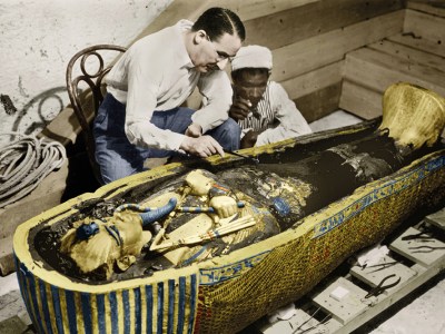 Howard Carter photographed with the golden sarcophagus of Tutankhamun in 1922 by Harry Burton (colourised version).