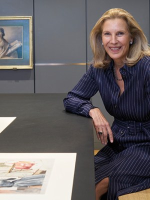 Katrin Bellinger photographed in her print room in London in May 2022. Behind her are drawings by Anne Guéret and Gjisbertus Johannus van den Berg.