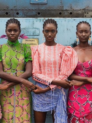 Models hold hands during Lagos Fashion Week. Courtesy Lagos Fashion Week; photo: Stephen Tayo