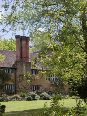 The view of Munstead Wood house across the west lawn.
