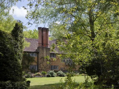 The view of Munstead Wood house across the west lawn.