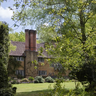 The view of Munstead Wood house across the west lawn.