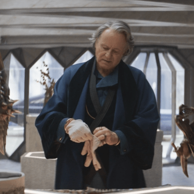 Stellan Skarsgård as antiquities dealer and spymaster in Andor. Standing in his showroom with pieces of ancient armour and jewellery